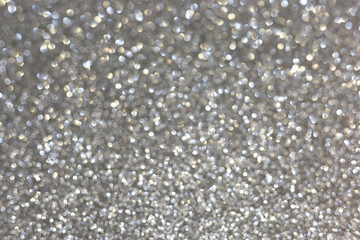 Silver abstract defocused bokeh background. Sparkling texture