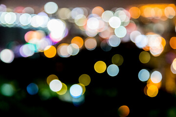Fototapeta premium Blur defocus bokeh of light in the city with dark