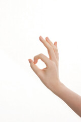 woman's hand gesture indicating excellence on white background