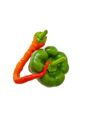 Green and red bell pepper on a white background. The concept of a healthy diet.