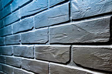 the surface of the brickwork is painted blue