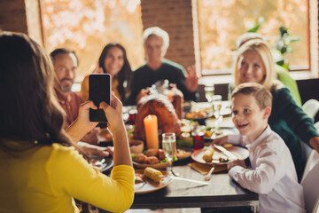 Photo of family meeting served table thanks giving dinner little girl hold telephone make portrait...