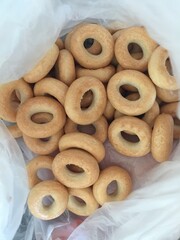 small bagels with salt in a bag, selective focus. tarallini are typical foods Italy
