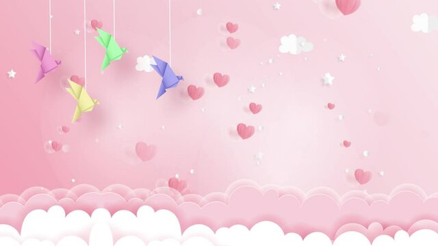Colorful paper birds and hearts floating on strings in bright pink background - animation