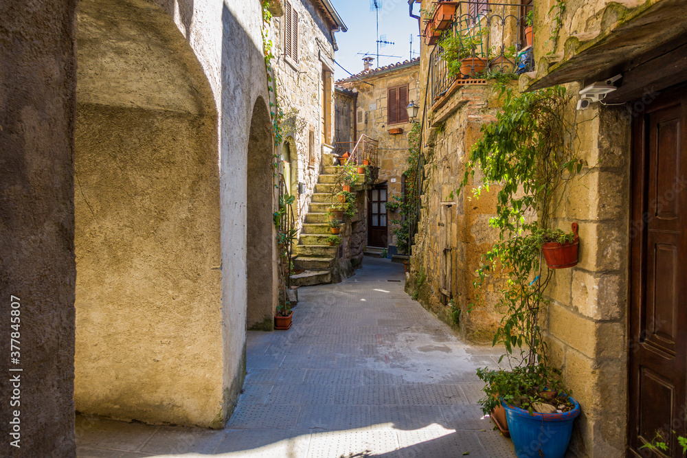 Wall mural pitigliano, tuscany perched on tuff cliff, old town and alleys. splendid town in the tufo area, in t