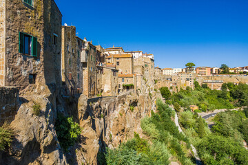 Pitigliano, Tuscany perched on tuff cliff, Old Town and alleys. Splendid town in the Tufo Area, in the heart of Tuscan Maremma, Pitigliano perched on tuff cliff one of most beautiful villages in Italy