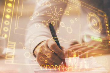 Man in white shirt with technology icons.