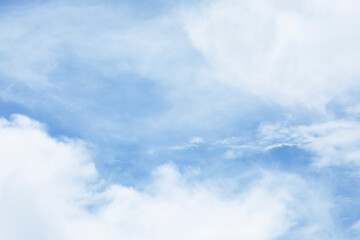 Blue sky background and white clouds soft focus, and copy space