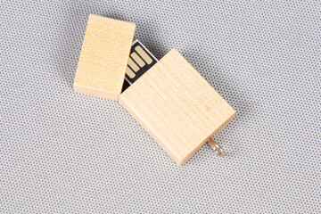 USB memory stick in wooden open  on white background