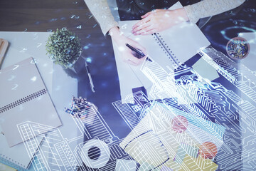 IOT drawing over writing hands in notepad background. Concept of smart home. Multi exposure