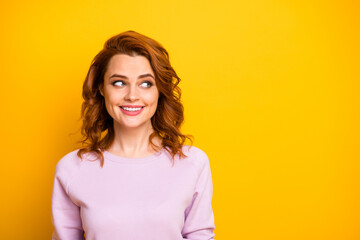 Obraz premium Closeup photo of beautiful pretty foxy wavy lady positive good mood easy-going person look side empty space wear pink sweater shirt isolated yellow color background