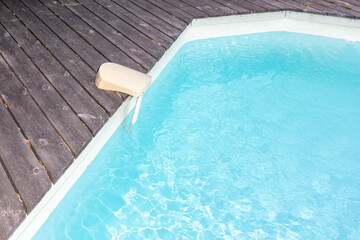 pool alarm positioned on side of swimming pool