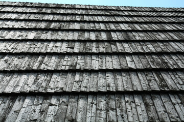 Roof covered with wooden tiles.