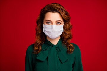 Close-up portrait of her she nice-looking attractive wavy-haired girl wear white medical mask prevent covid infection spread isolated over vivid vibrant red maroon burgundy color background