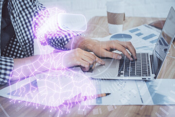 AR hologram with man working on computer on background. Augmented reality concept. Double exposure.