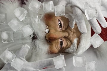 Santa Claus frozen in ice. Christmas in danger.The most important symbol of Christmas is trapped under the ice. Save Santa.
