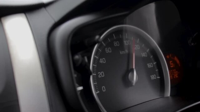 Fast Driving car  a speedometer 100 plus kilometers per hour display front passenger view point close up slow mo b roll clip