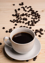 warm cup of coffee on brown background