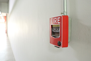 Fire alarm on the white wall.