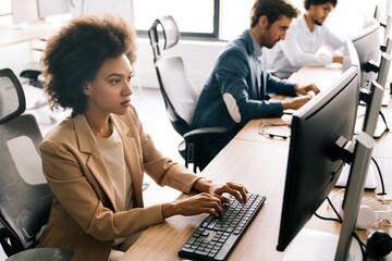 Successful happy woman working at office. Technology, computer, startup, business concept.