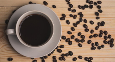 Obraz na płótnie Canvas warm cup of coffee on brown background