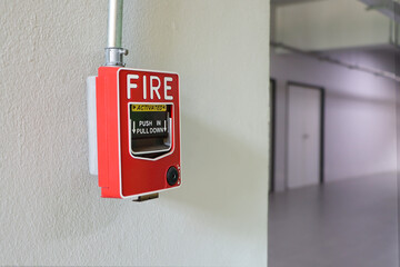 Fire alarm on the white wall.