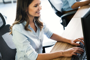 Successful happy woman working at office. Technology, computer, startup, business concept.