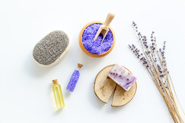 Fototapeta na wymiar Lavender spa set. Violet bath salt and essence oil on white background
