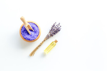 Lavender spa set. Violet bath salt and essence oil on white background