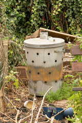 Garden incinerator on home allotment for burning green waste stock photo
