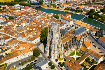 Picturesque summer view of historic areas of Saintes located on Charente river looking out over...