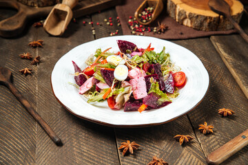 Vegetable salad with beets quail eggs and greens