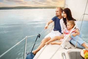 Fototapeta na wymiar happy family sailing on boat