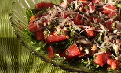 Seafood salad with pesto and pine nuts.