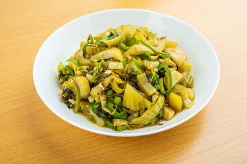 A dish of home-cooked sauerkraut on a wooden table
