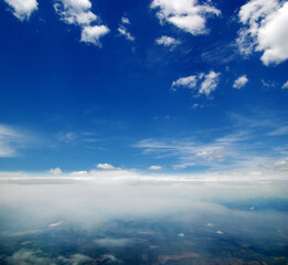 Fototapeta na wymiar Clouds a view from airplane window