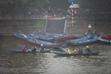 HANOI, VIETNAM - MARCH 30, 2015: Tourist sit on boat to visit HUONG Pagoda. HUONG Pagoda Festival is the biggest and longest annual festival in Vietnam. The festival is opened in MY DUC district