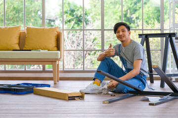 Handyman installing wooden bench in new house.