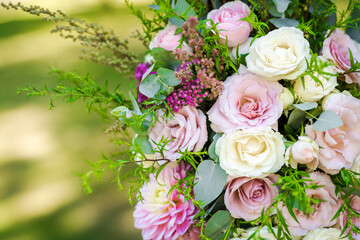 Fototapeta na wymiar Fresh flower decoration of a wedding arch - pink and white fresh flowers. Fresh roses flower arrangement