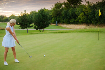 Player Woman Hit Ball Into Golf Tee .