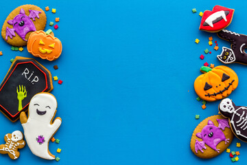 Fototapeta premium Flat lay of homemade Halloween cookies. Top view, copy space