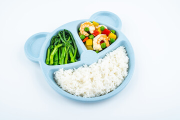A plate of nutritious children's meal on white background