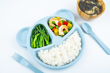 A plate of nutritious children's meal on white background
