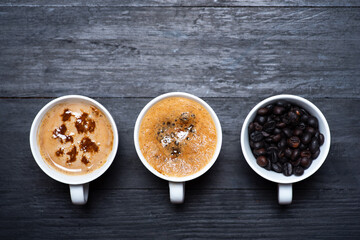 Cup of coffee, roasted beans top view with