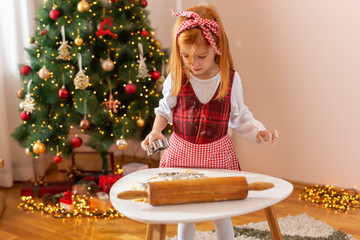 Little girl making Christmas cookies