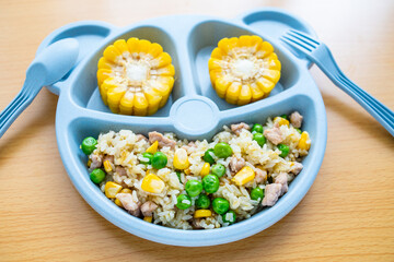A plate of children's nutritious luncheon meat fried rice on the table