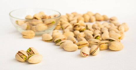 roasted pistachios on white background