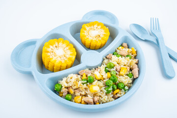 Nutritional meal for children on a plate on white background