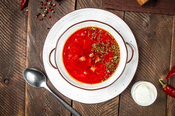 Russian traditional soup borsch on wooden table