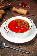 Russian traditional soup borsch on wooden table